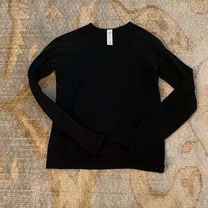 This is a black long sleeve Athleta Girl top